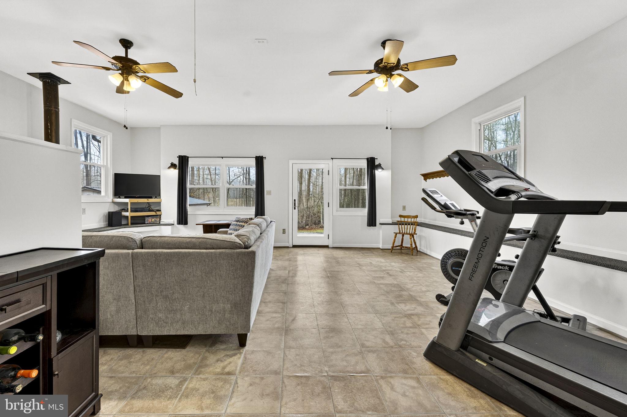 2266 Beaver Dam Road Midland, VA 22728 - Photo 42 of 93 a living room with furniture and a ceiling fan