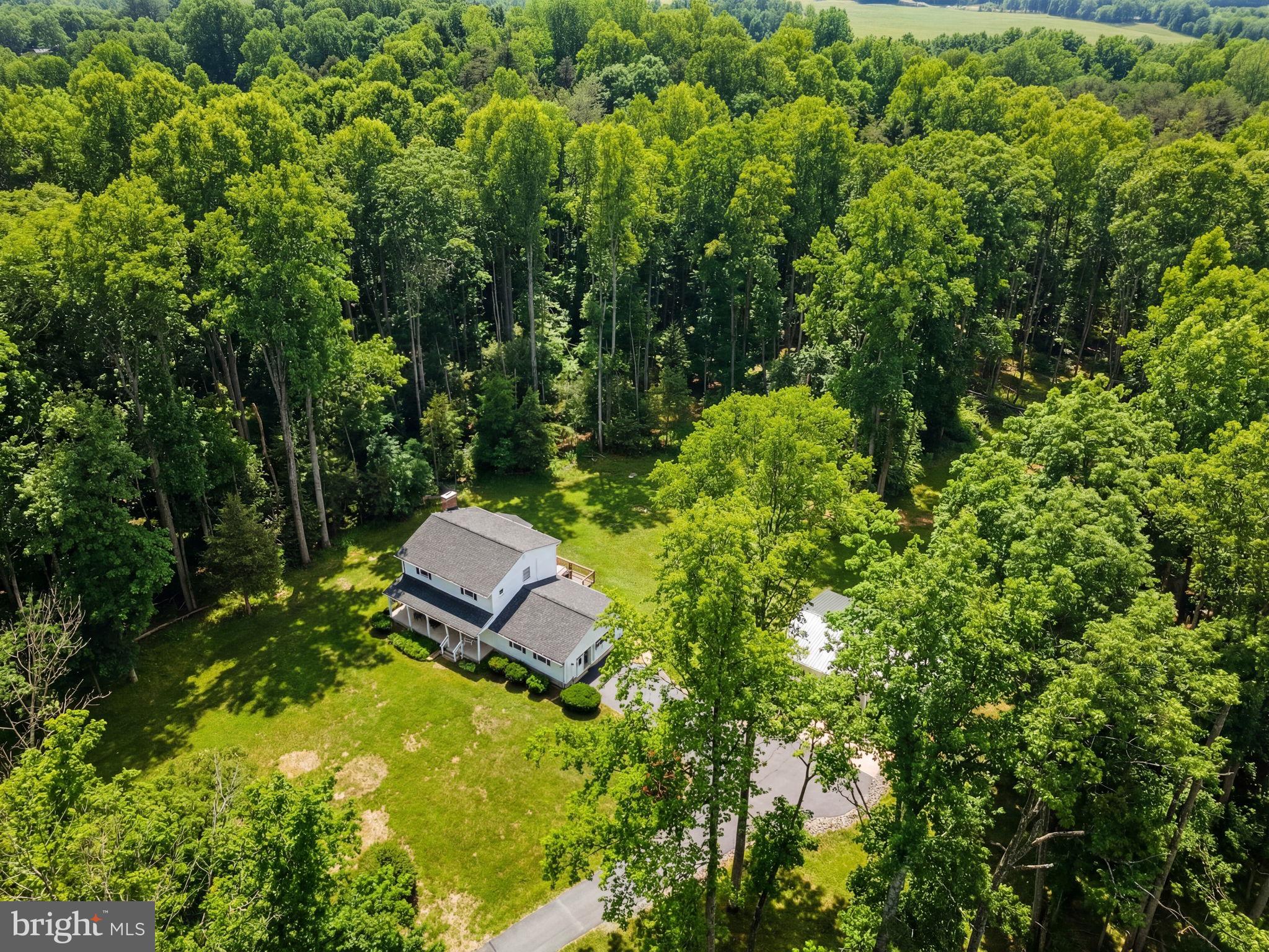 2266 Beaver Dam Road Midland, VA 22728 - Photo 7 of 93 a backyard of a house with lots of green space and fountain