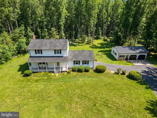 a kitchen with stainless steel appliances granite countertop a refrigerator stove top oven a sink and dishwasher