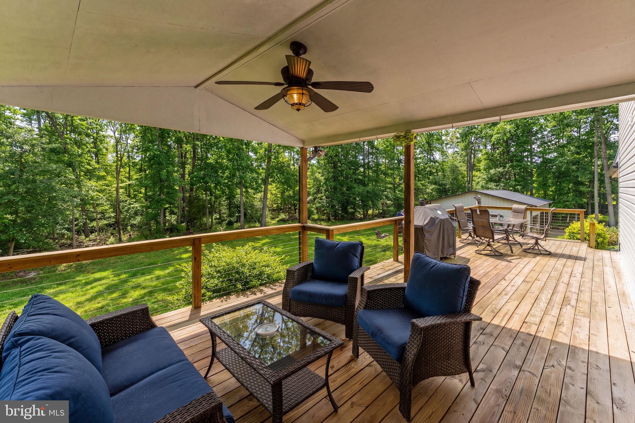 2266 Beaver Dam Road Midland, VA 22728 - Photo 80 of 93 a balcony with wooden floor and outdoor seating