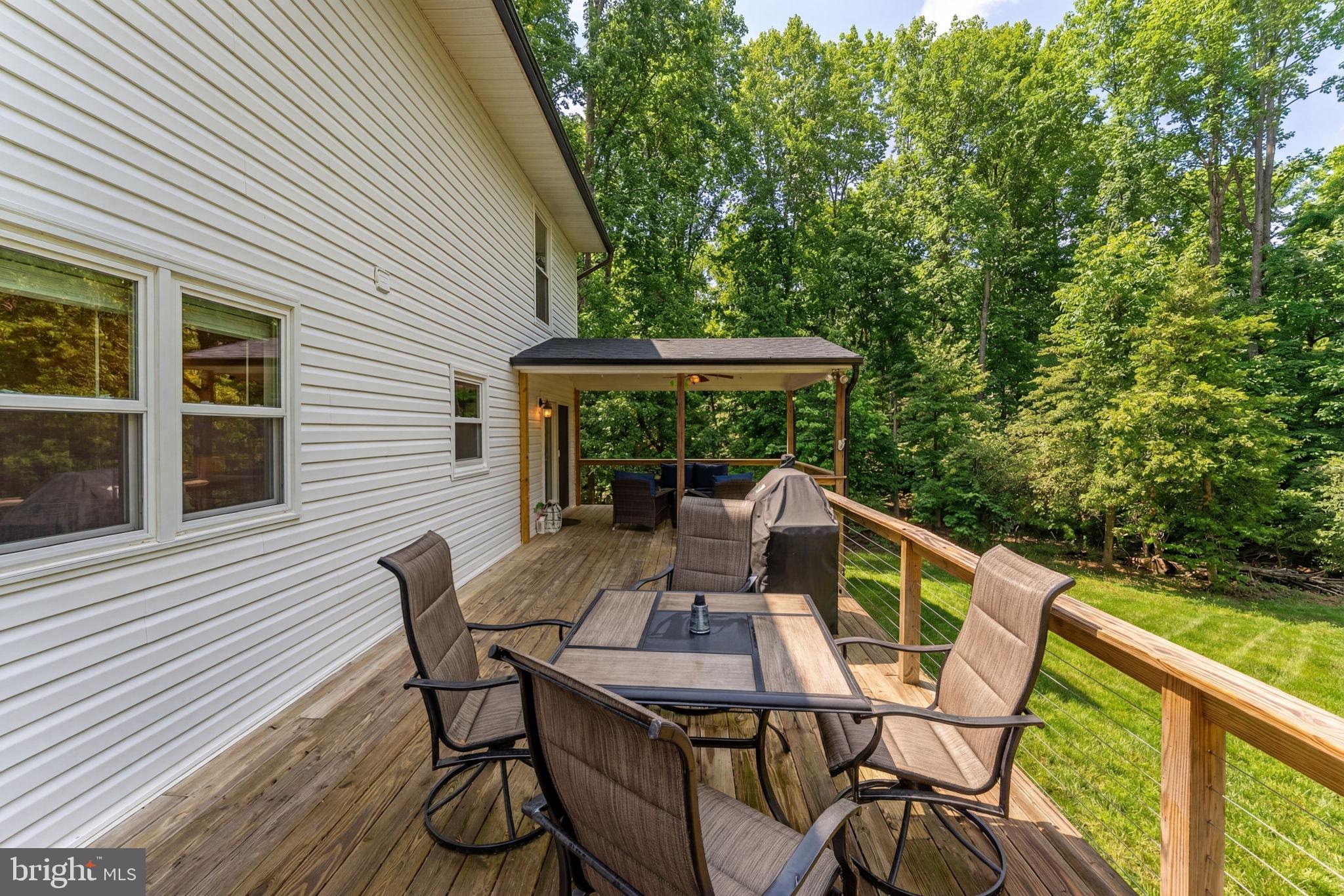2266 Beaver Dam Road Midland, VA 22728 - Photo 82 of 93 a view of deck with furniture and trees around