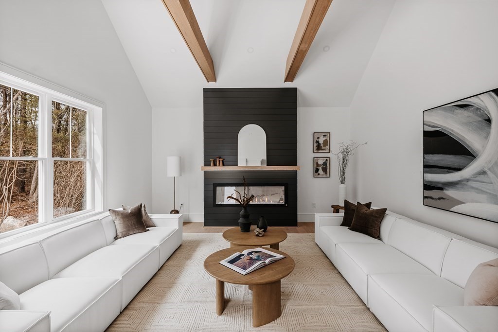 5 Brookside Lane Burlington, MA 01803 - Photo 11 of 40 a living room with furniture and a fireplace