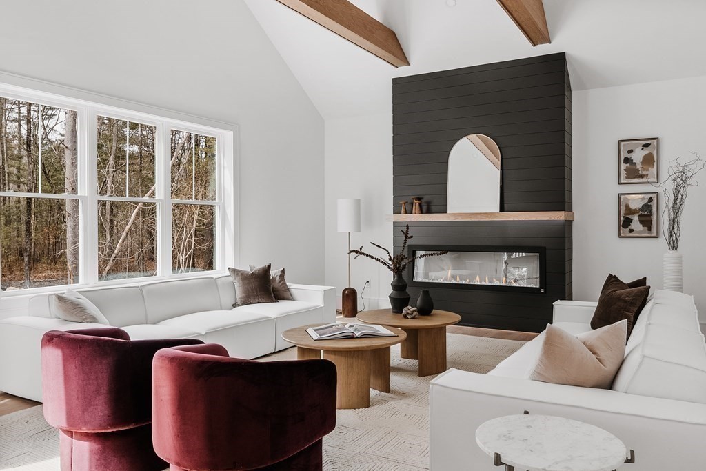 5 Brookside Lane Burlington, MA 01803 - Photo 12 of 40 a living room with furniture a window and a fireplace