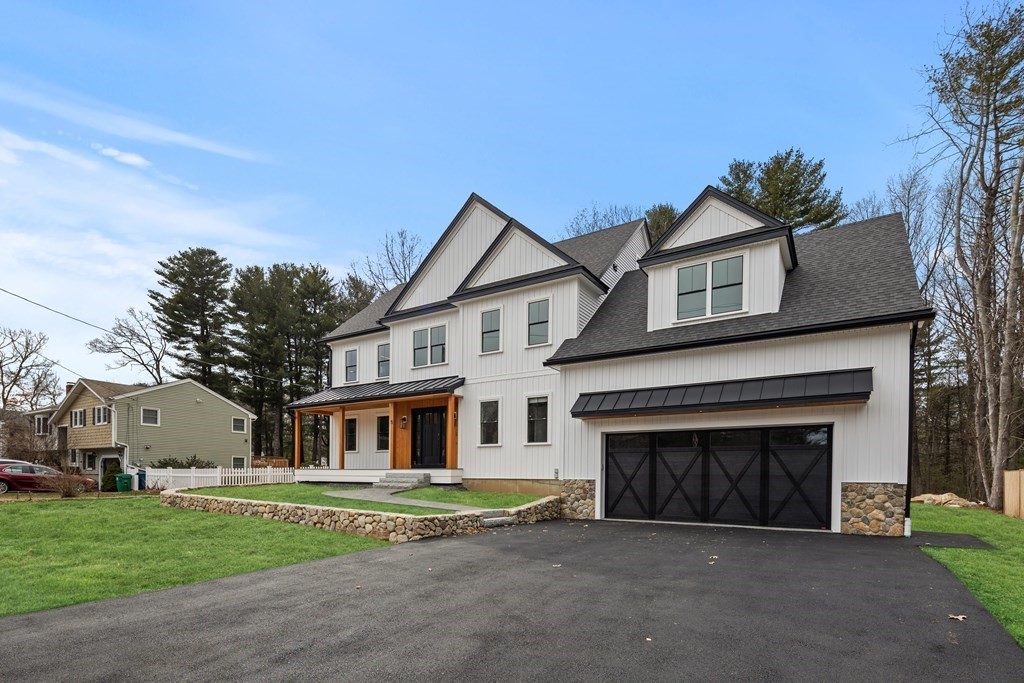 5 Brookside Lane Burlington, MA 01803 - Photo 2 of 40 a front view of a house with a garden and yard