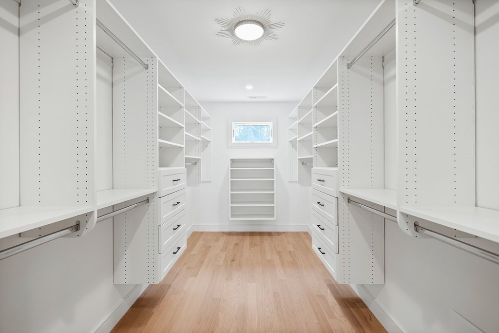 5 Brookside Lane Burlington, MA 01803 - Photo 22 of 40 a view of walk in closet with empty racks