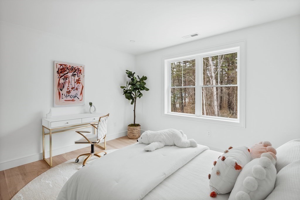 5 Brookside Lane Burlington, MA 01803 - Photo 27 of 40 a bedroom with a bed and a window