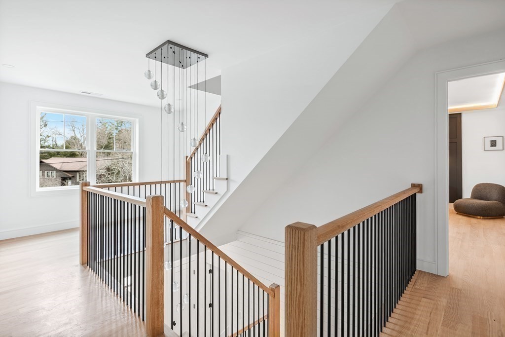 5 Brookside Lane Burlington, MA 01803 - Photo 34 of 40 a view of staircase with wooden floor and a window