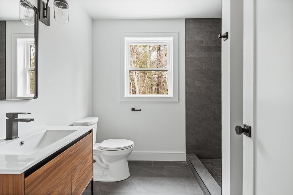 5 Brookside Lane Burlington, MA 01803 - Photo 37 of 40 a bathroom with a sink toilet and shower