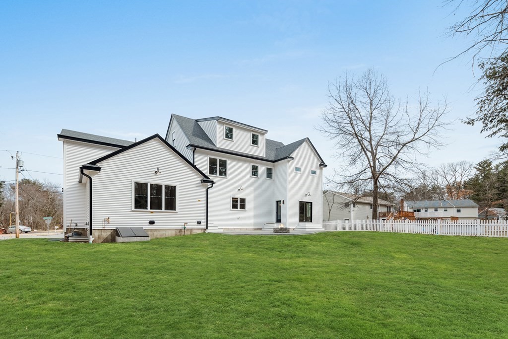 5 Brookside Lane Burlington, MA 01803 - Photo 40 of 40 a view of a white house with a big yard and large trees