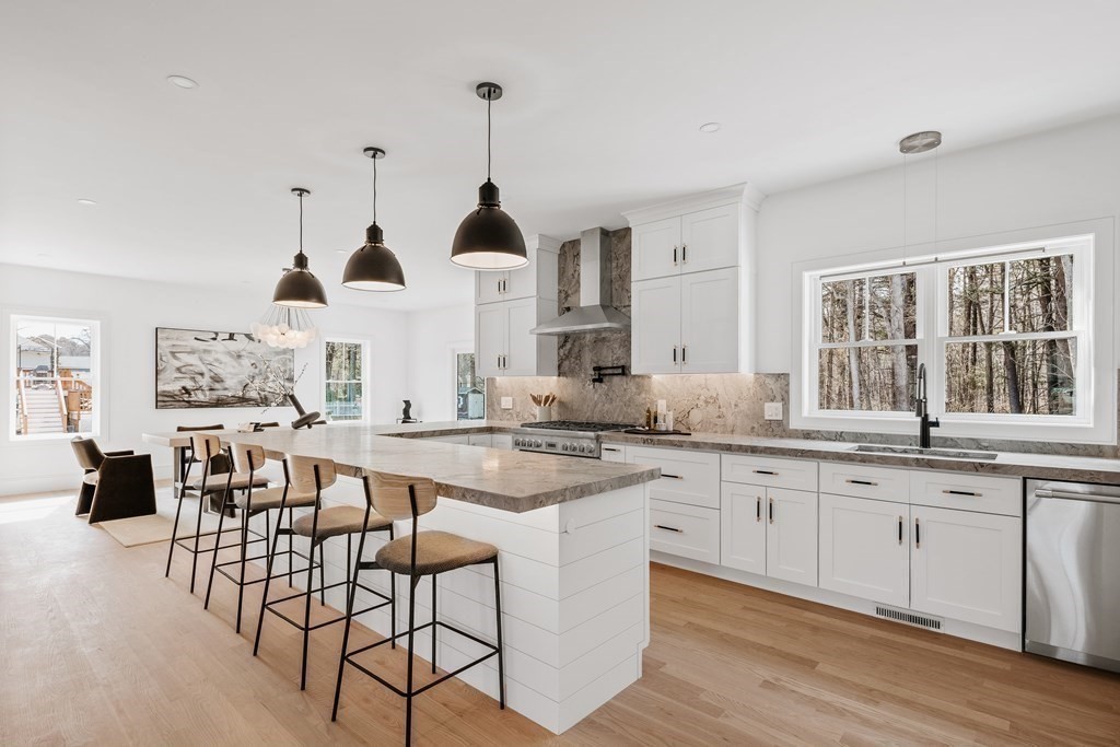 5 Brookside Lane Burlington, MA 01803 - Photo 8 of 40 a kitchen with stainless steel appliances kitchen island granite countertop a sink and cabinets