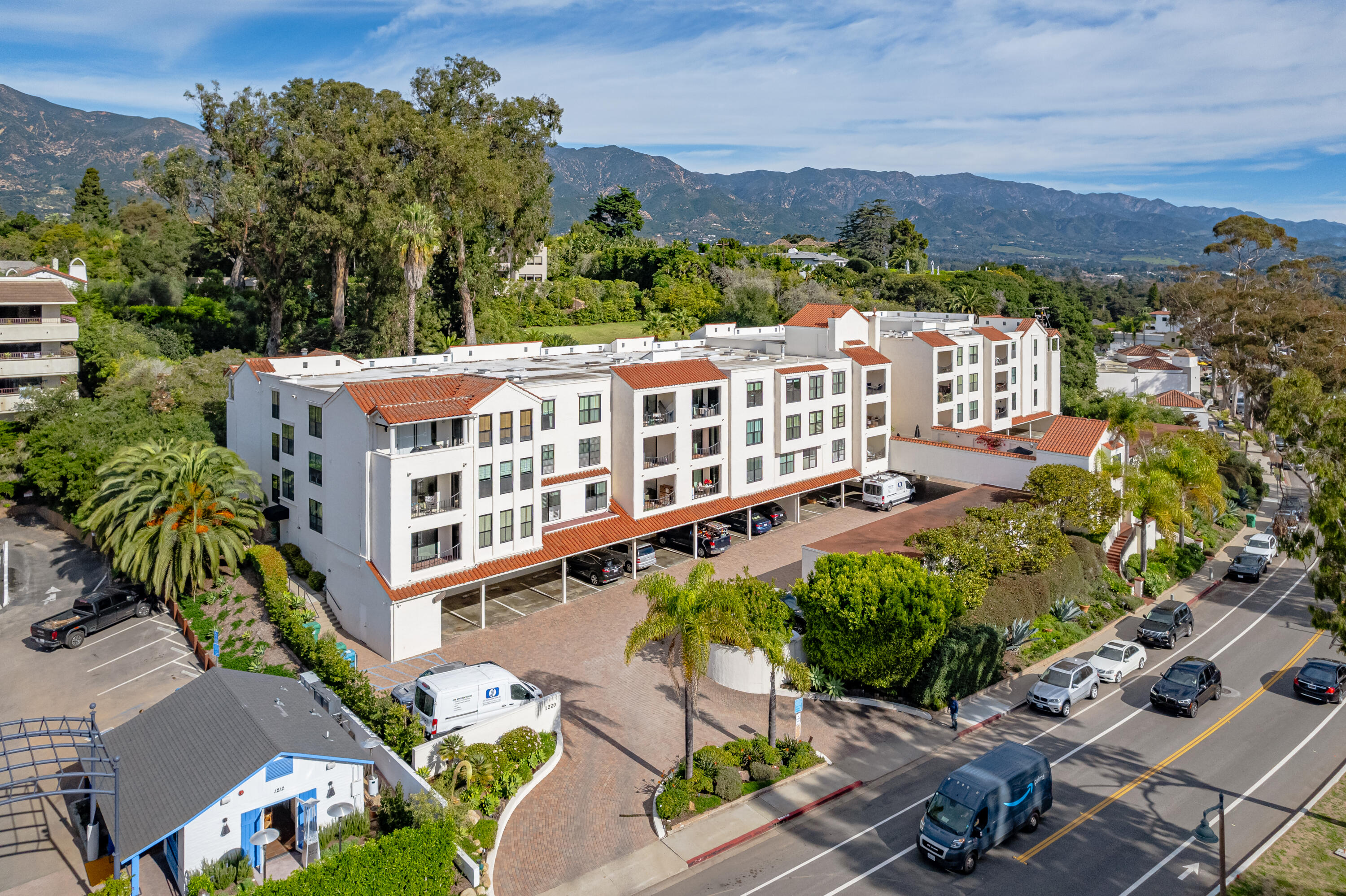 an aerial view of a house with a yard