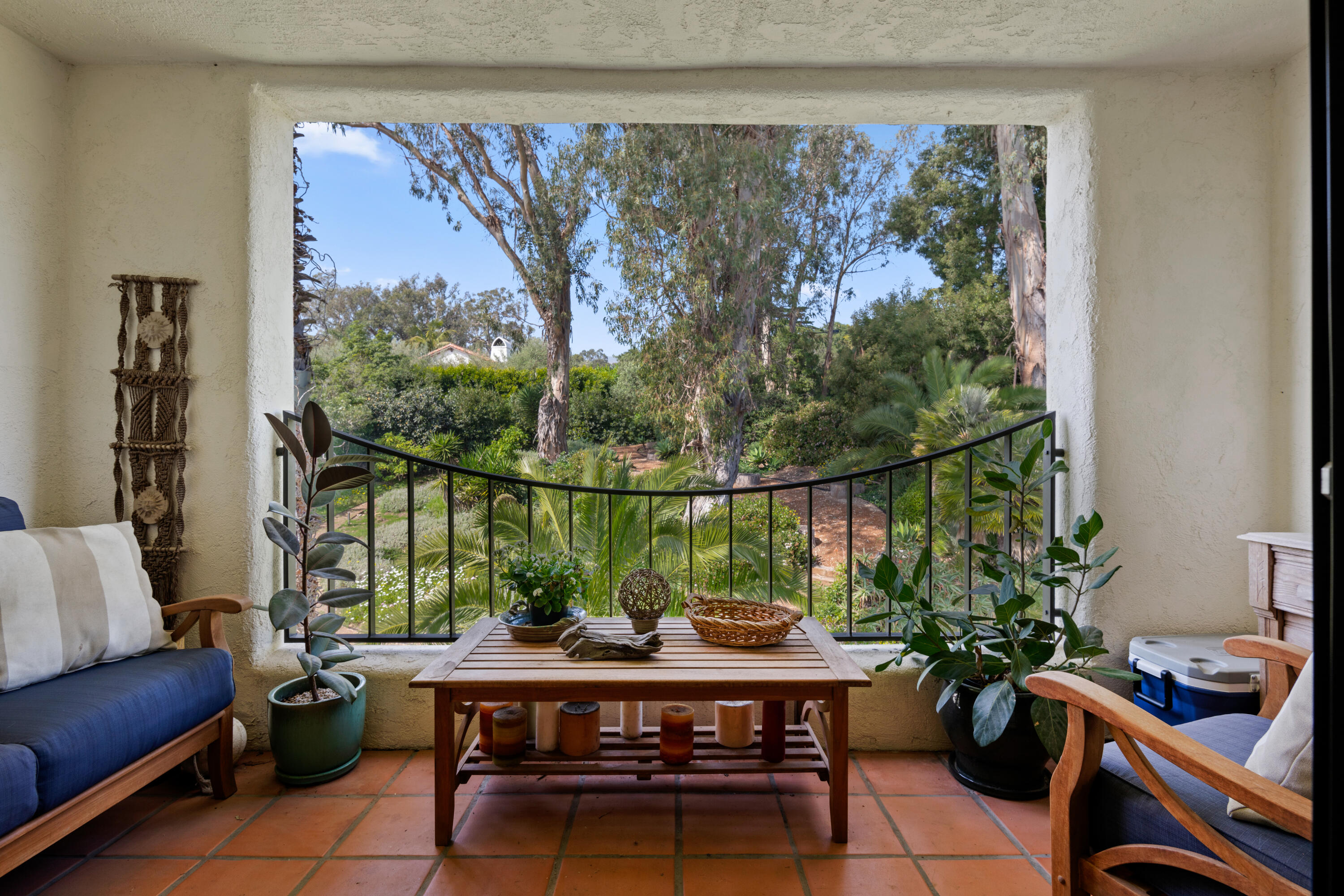 1220 Coast Village Road, Unit 303 Santa Barbara, CA 93108 - Photo 14 of 29 a living room with furniture and a potted plant