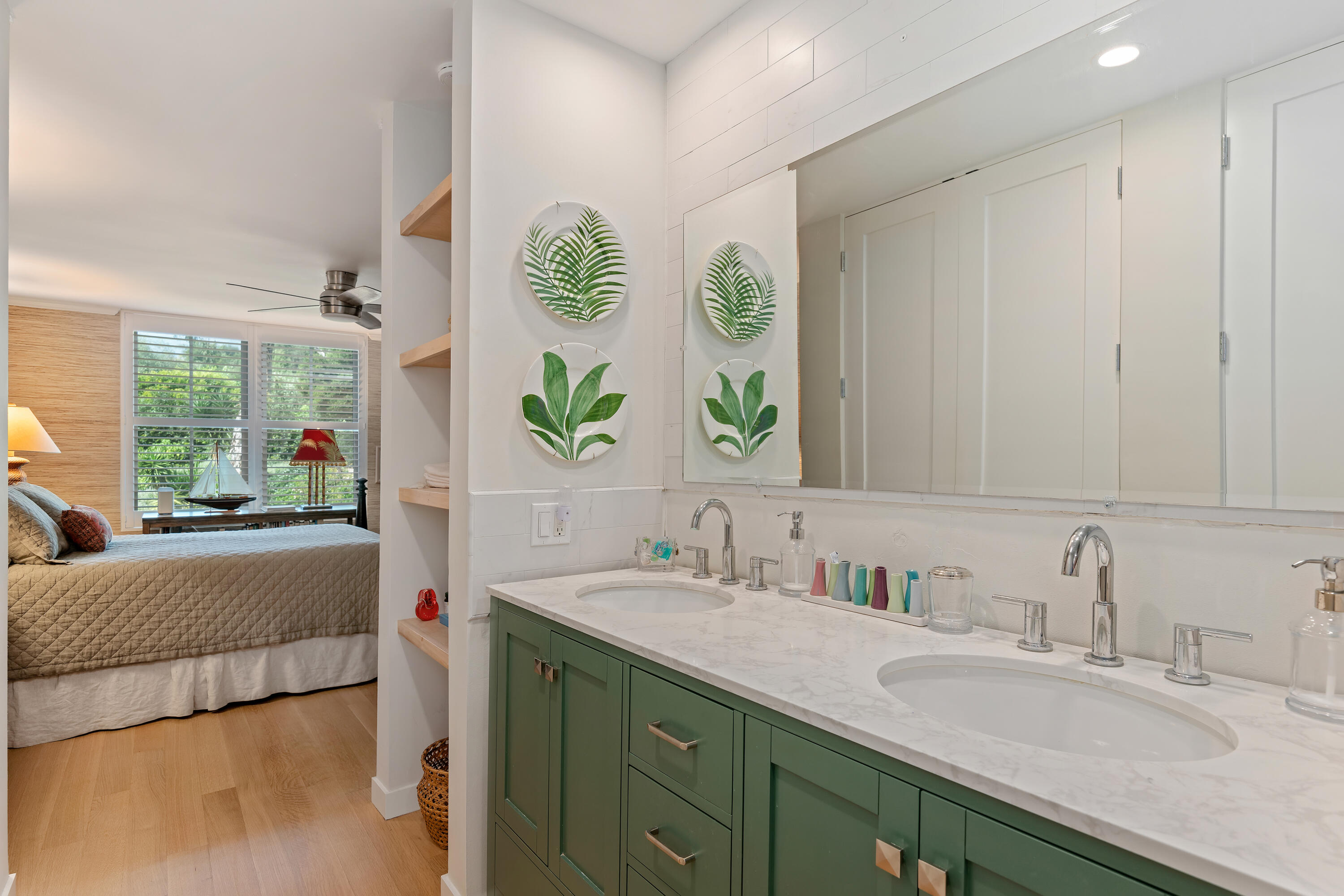 1220 Coast Village Road, Unit 303 Santa Barbara, CA 93108 - Photo 21 of 29 a en suite bathroom with a granite countertop sink and a large mirror next to a window