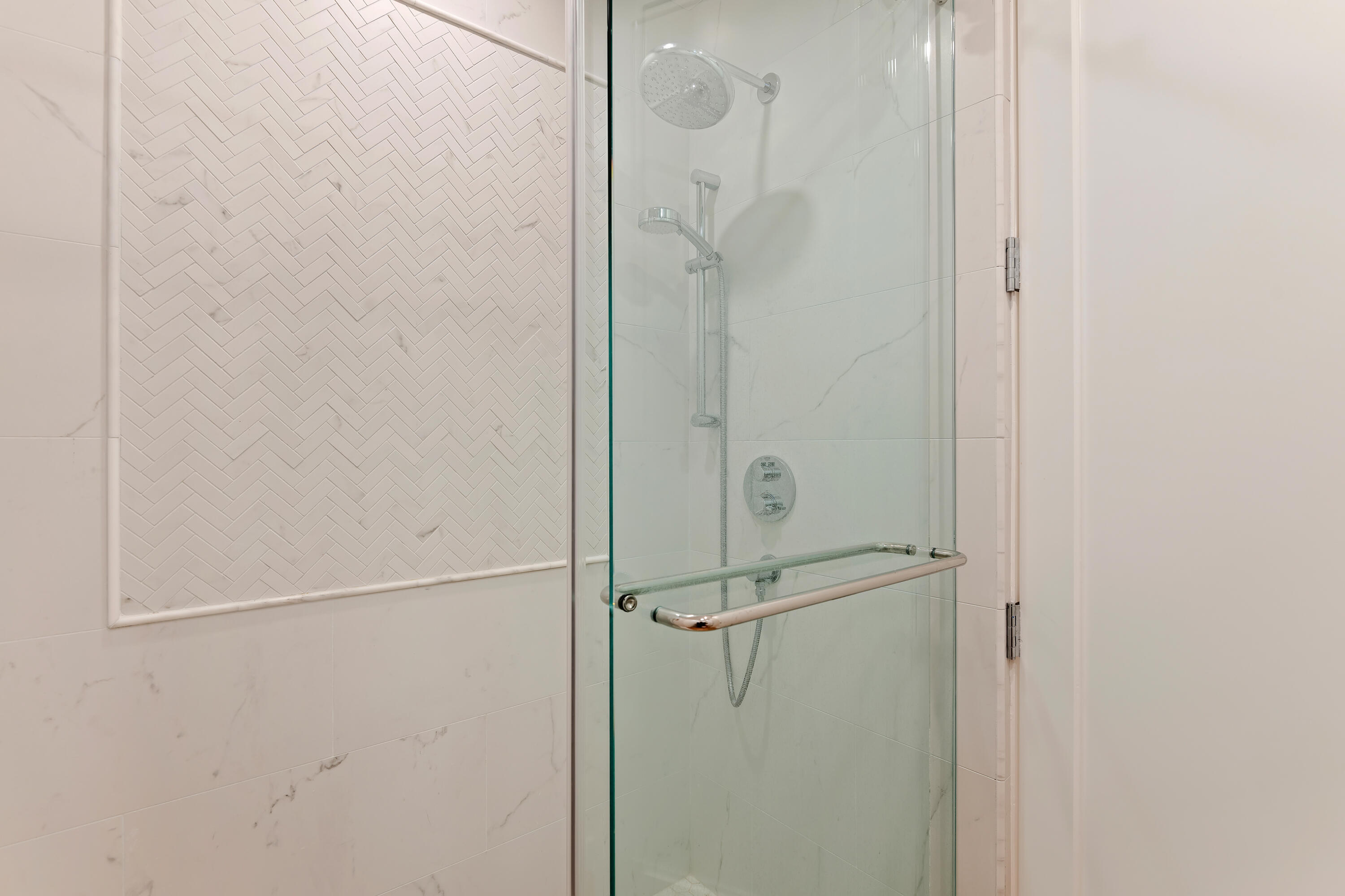 1220 Coast Village Road, Unit 303 Santa Barbara, CA 93108 - Photo 22 of 29 a bathroom with a glass shower door