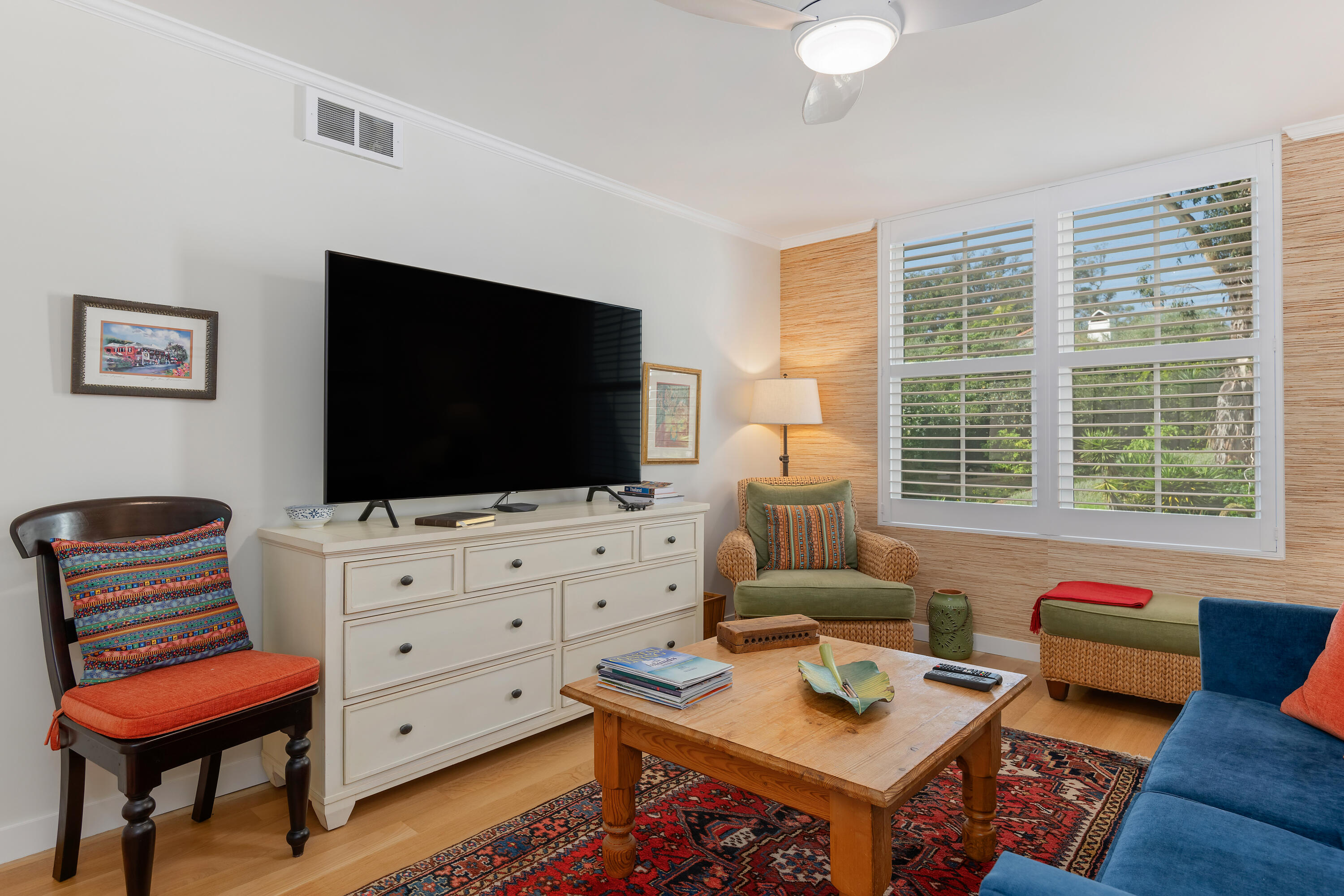 1220 Coast Village Road, Unit 303 Santa Barbara, CA 93108 - Photo 24 of 29 a living room with furniture and a flat screen tv