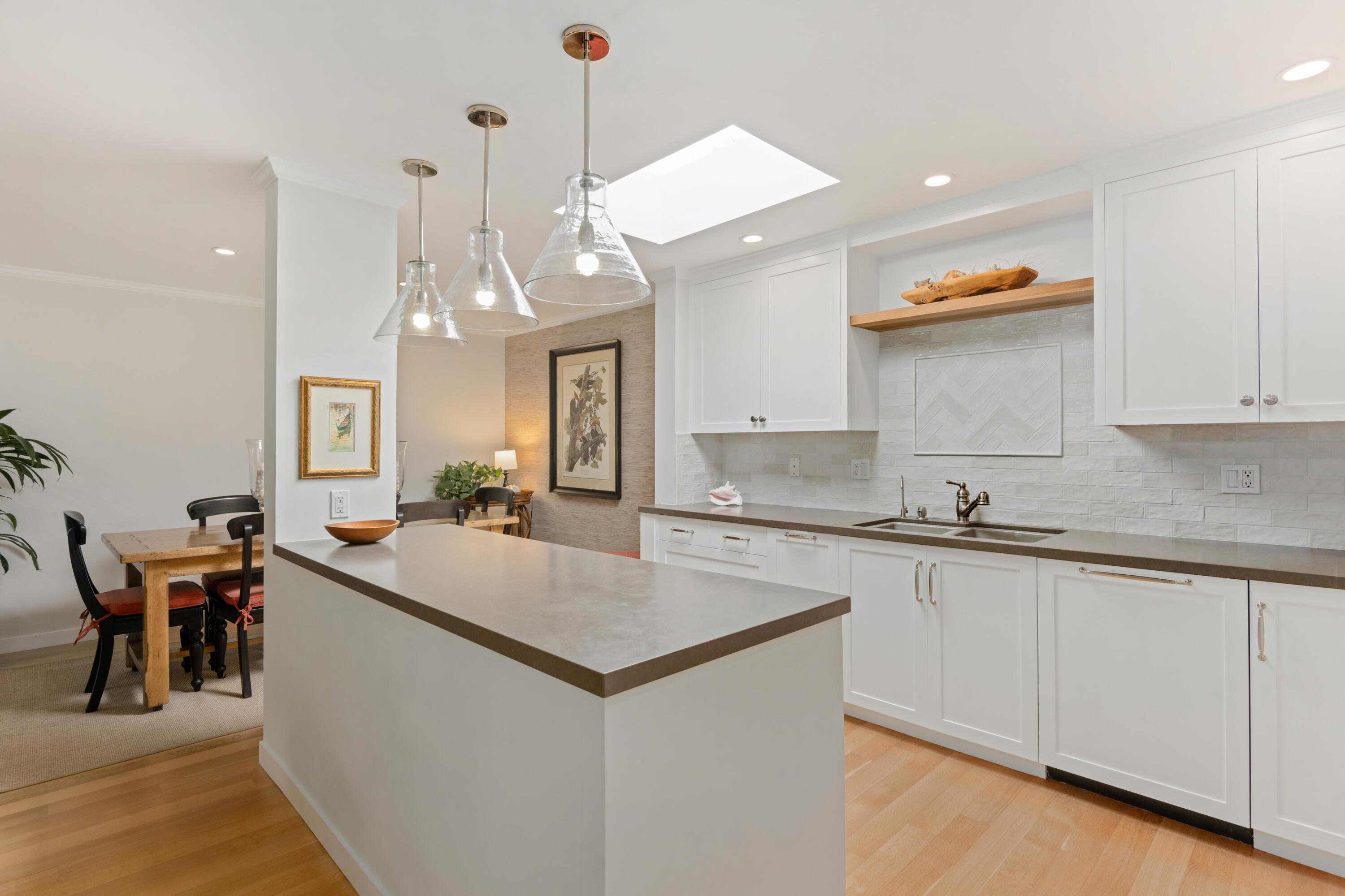 1220 Coast Village Road, Unit 303 Santa Barbara, CA 93108 - Photo 6 of 29 a kitchen with stainless steel appliances a sink stove and cabinets