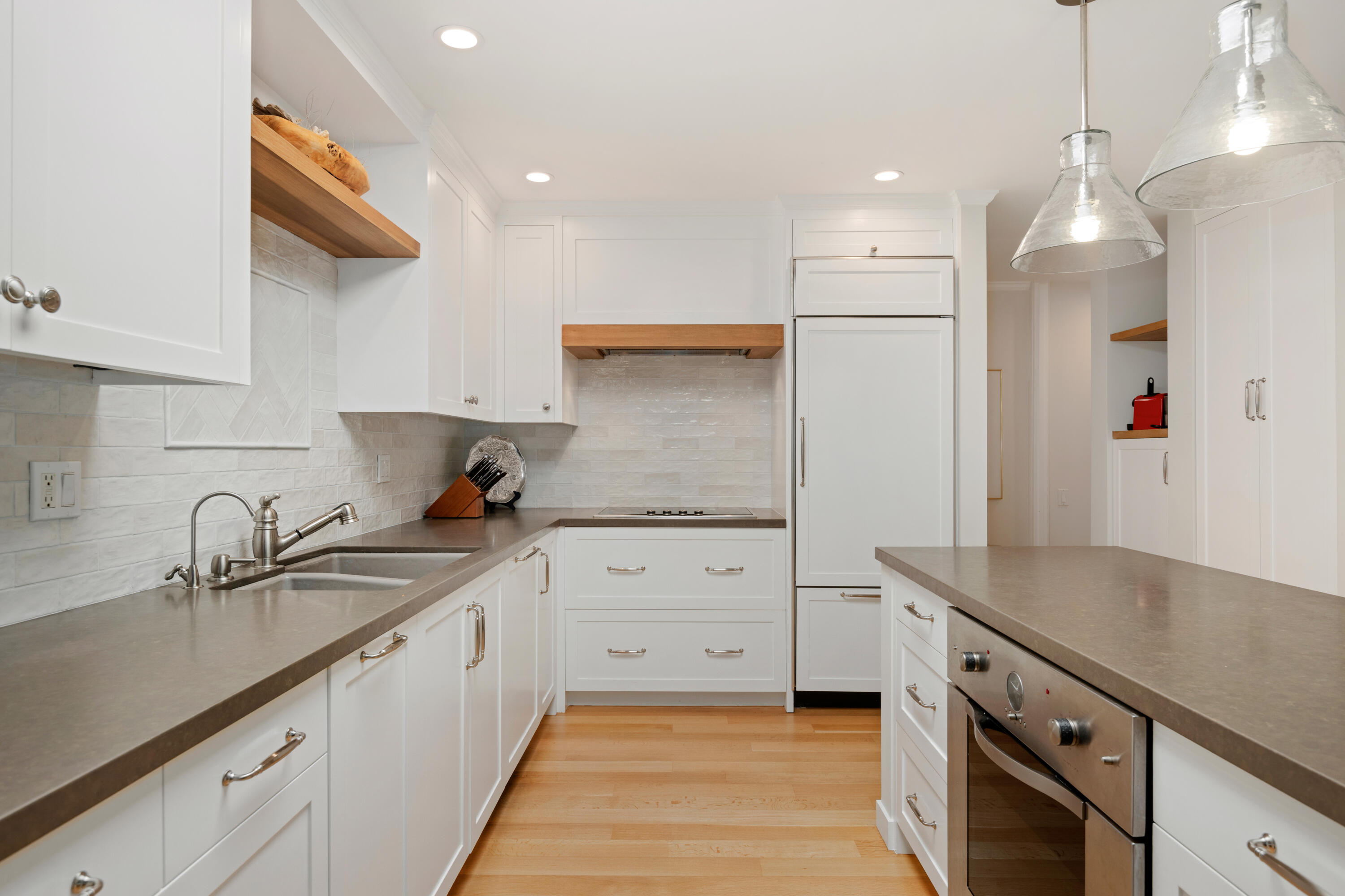 1220 Coast Village Road, Unit 303 Santa Barbara, CA 93108 - Photo 8 of 29 a kitchen with granite countertop a sink a stove and cabinets
