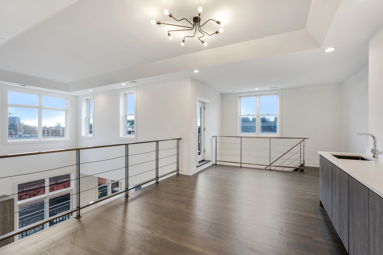 822 West Hubbard Street, Unit 5 Chicago, IL 60642 - Photo 13 of 31 a view of an empty room with wooden floor and a window