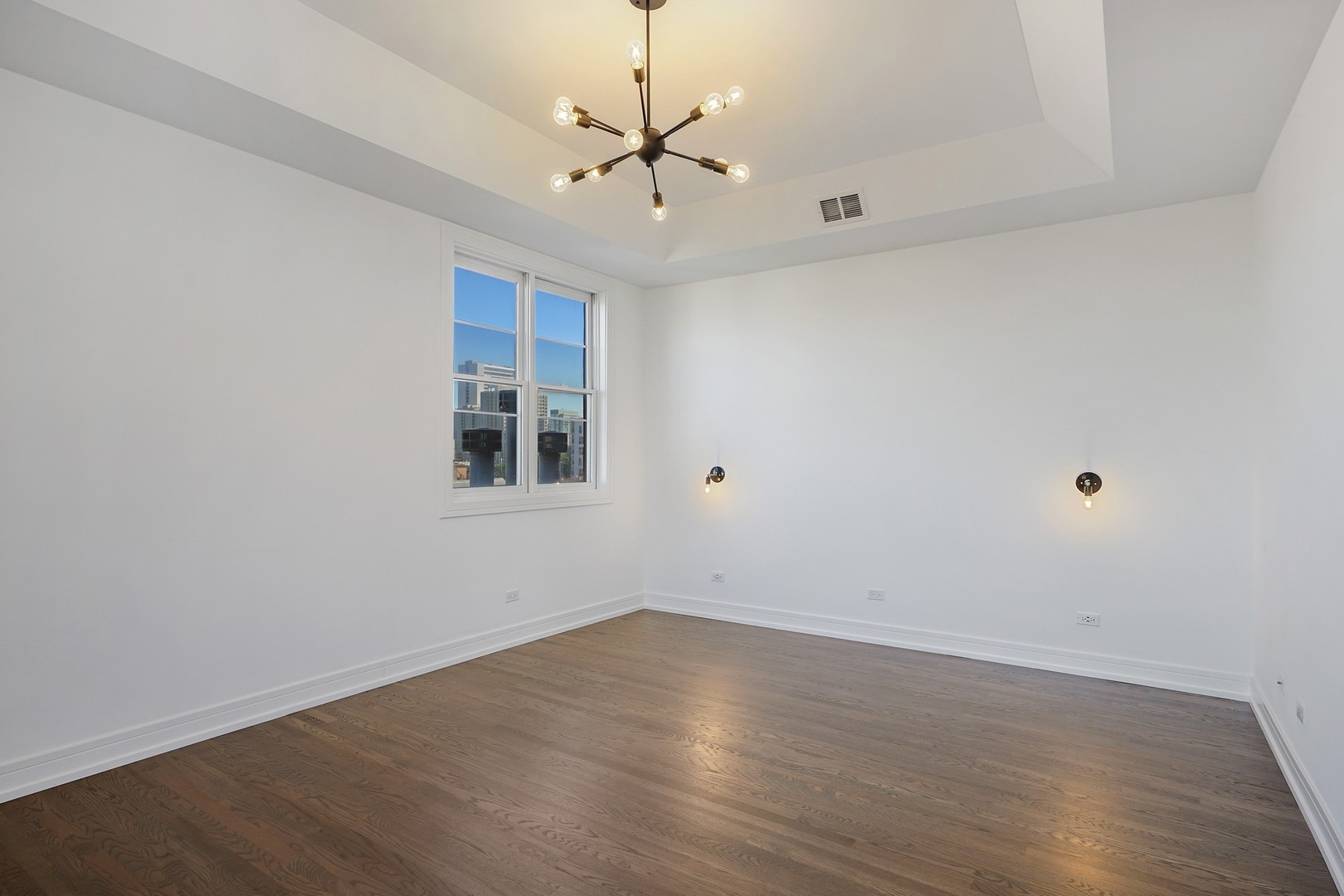 822 West Hubbard Street, Unit 5 Chicago, IL 60642 - Photo 15 of 31 wooden floor in an empty room with a window