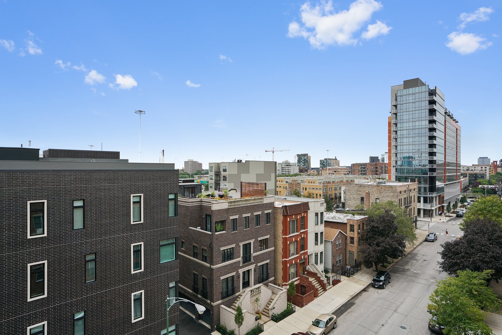822 West Hubbard Street, Unit 5 Chicago, IL 60642 - Photo 24 of 31 a view of a city with tall buildings