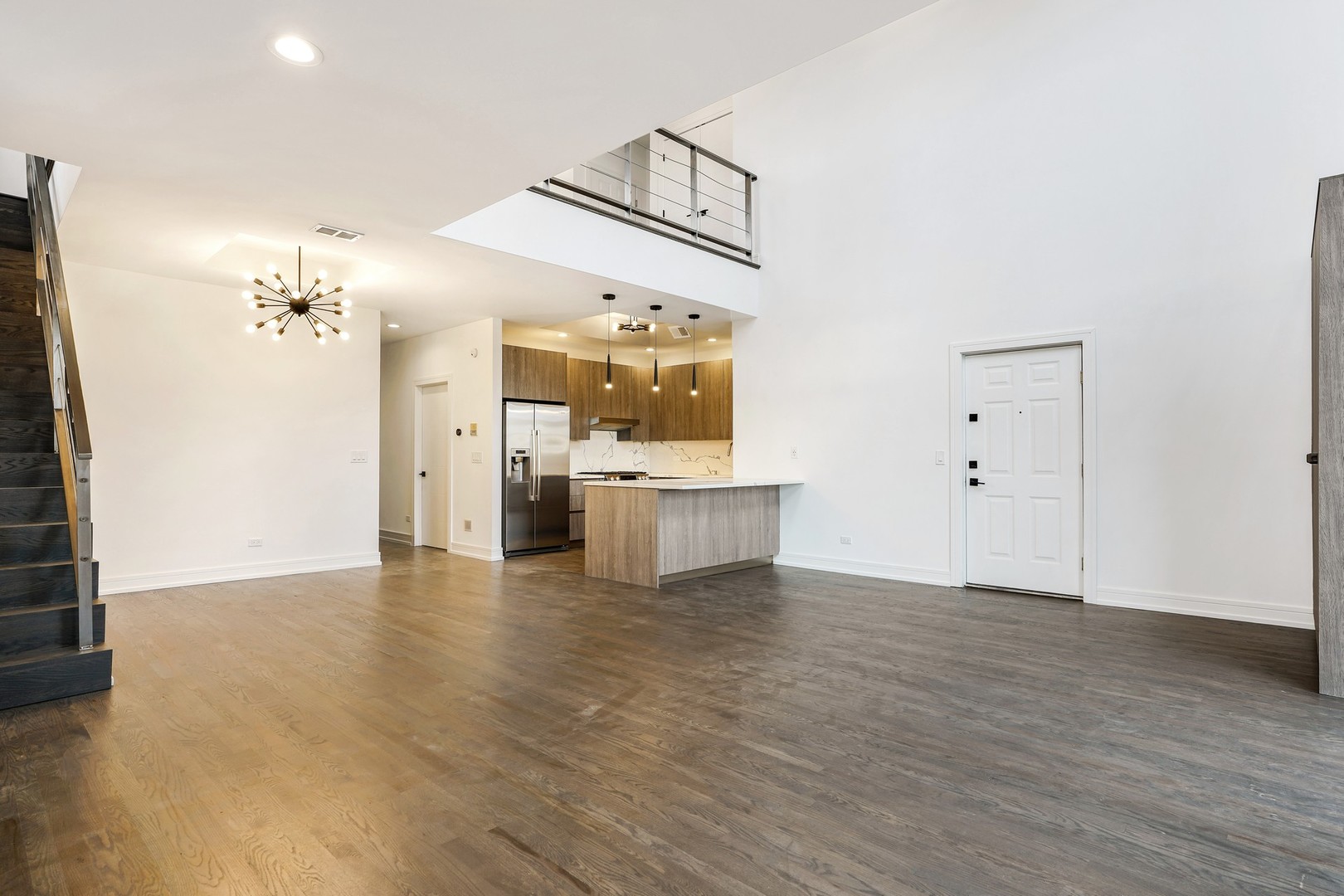 822 West Hubbard Street, Unit 5 Chicago, IL 60642 - Photo 4 of 31 a view of a kitchen with cabinets and wooden floor