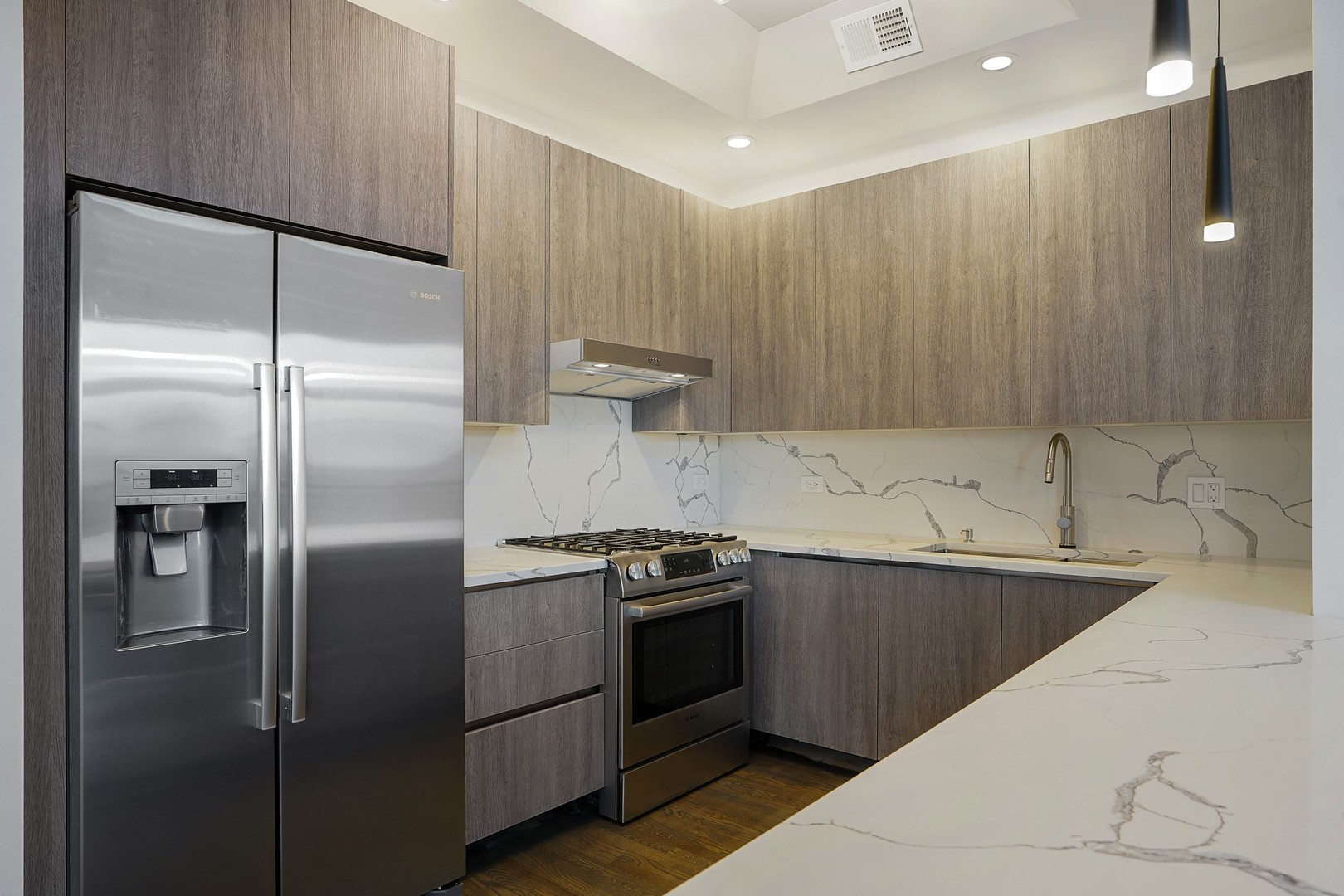 822 West Hubbard Street, Unit 5 Chicago, IL 60642 - Photo 6 of 31 a kitchen with a refrigerator and a sink