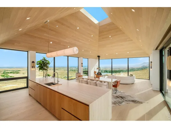 a kitchen with a sink and a large window