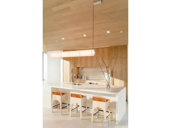 a bathroom with a sink a mirror and a window