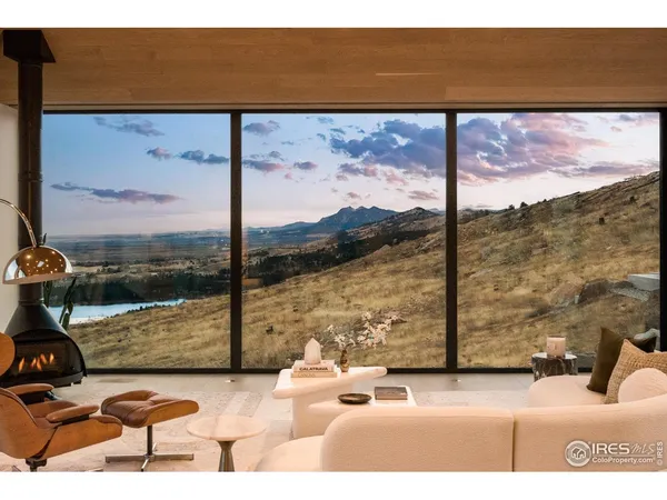 a view of a floor to ceiling window with an outdoor view