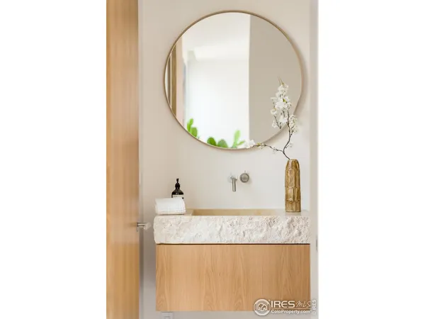a picture of a bathroom with a sink and a mirror