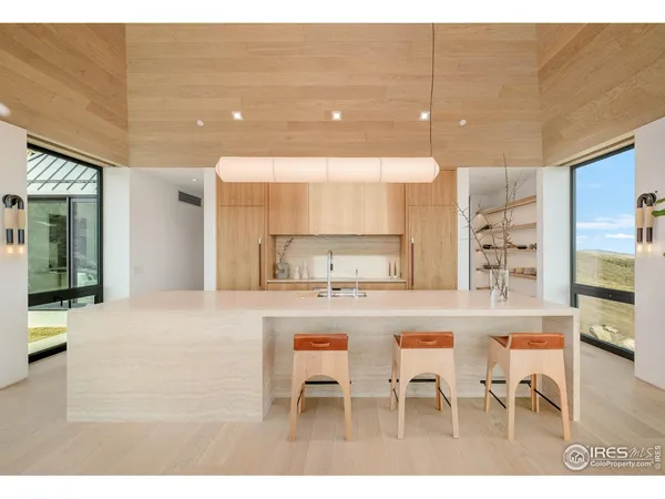 a kitchen with kitchen island cabinets and refrigerator