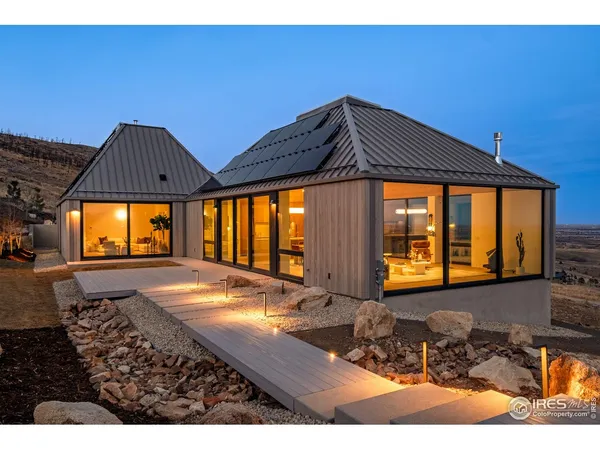 a balcony with furniture and a potted plant