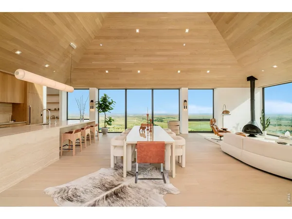 a living room with furniture and large window