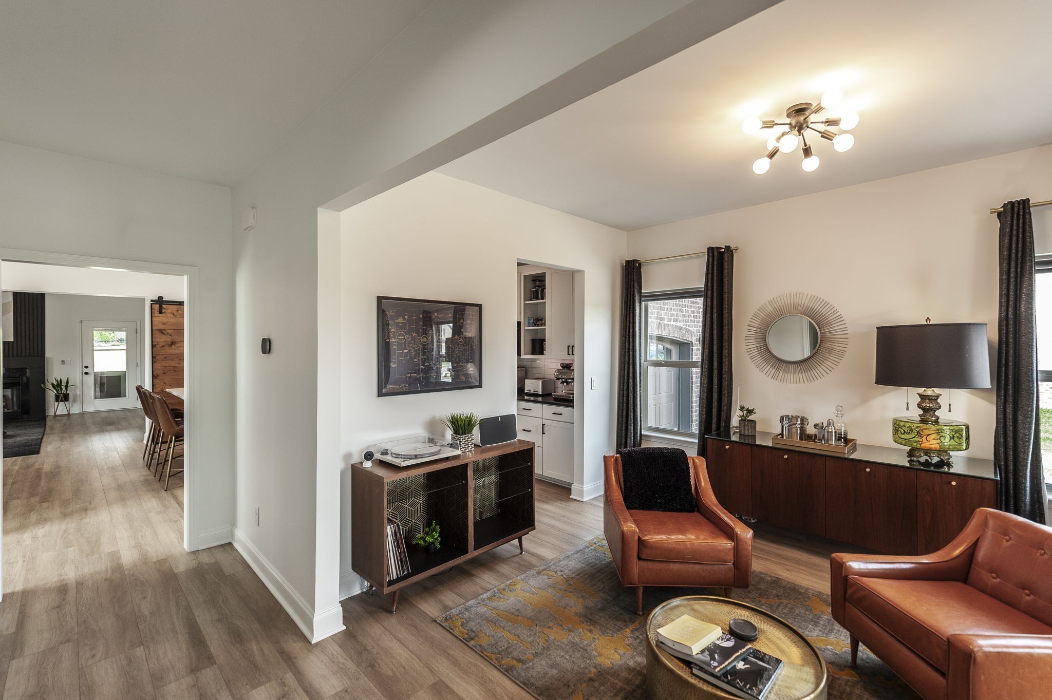 400 Quarry Road Gallatin, TN 37066 - Photo 11 of 81 a living room with furniture a flat screen tv and kitchen view