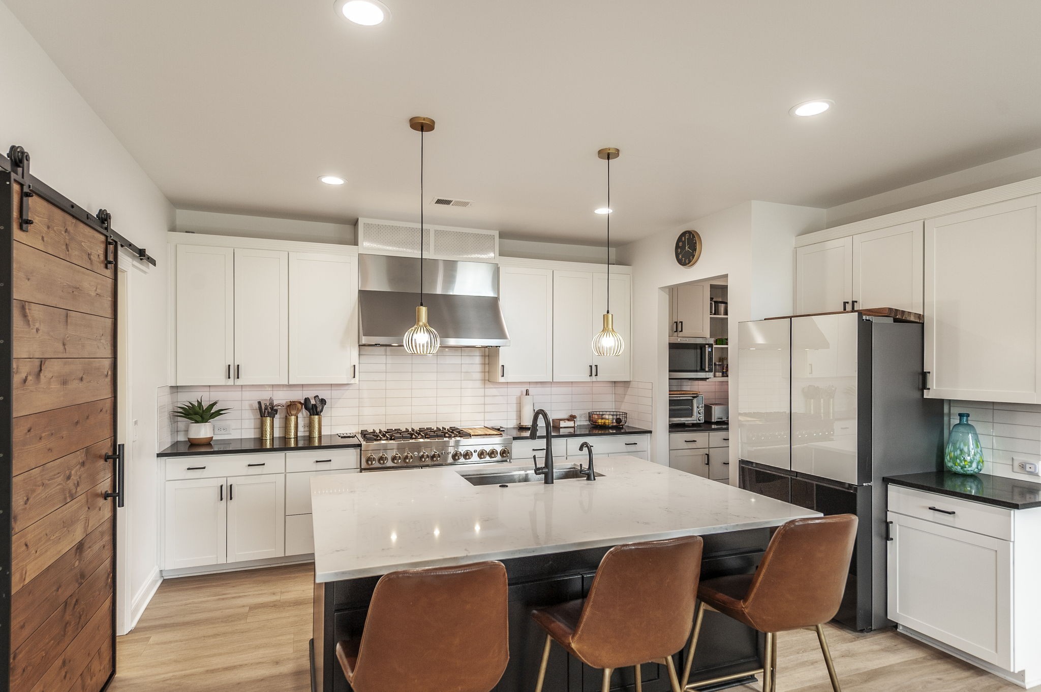 400 Quarry Road Gallatin, TN 37066 - Photo 18 of 81 a kitchen with stainless steel appliances granite countertop a dining table chairs refrigerator and microwave