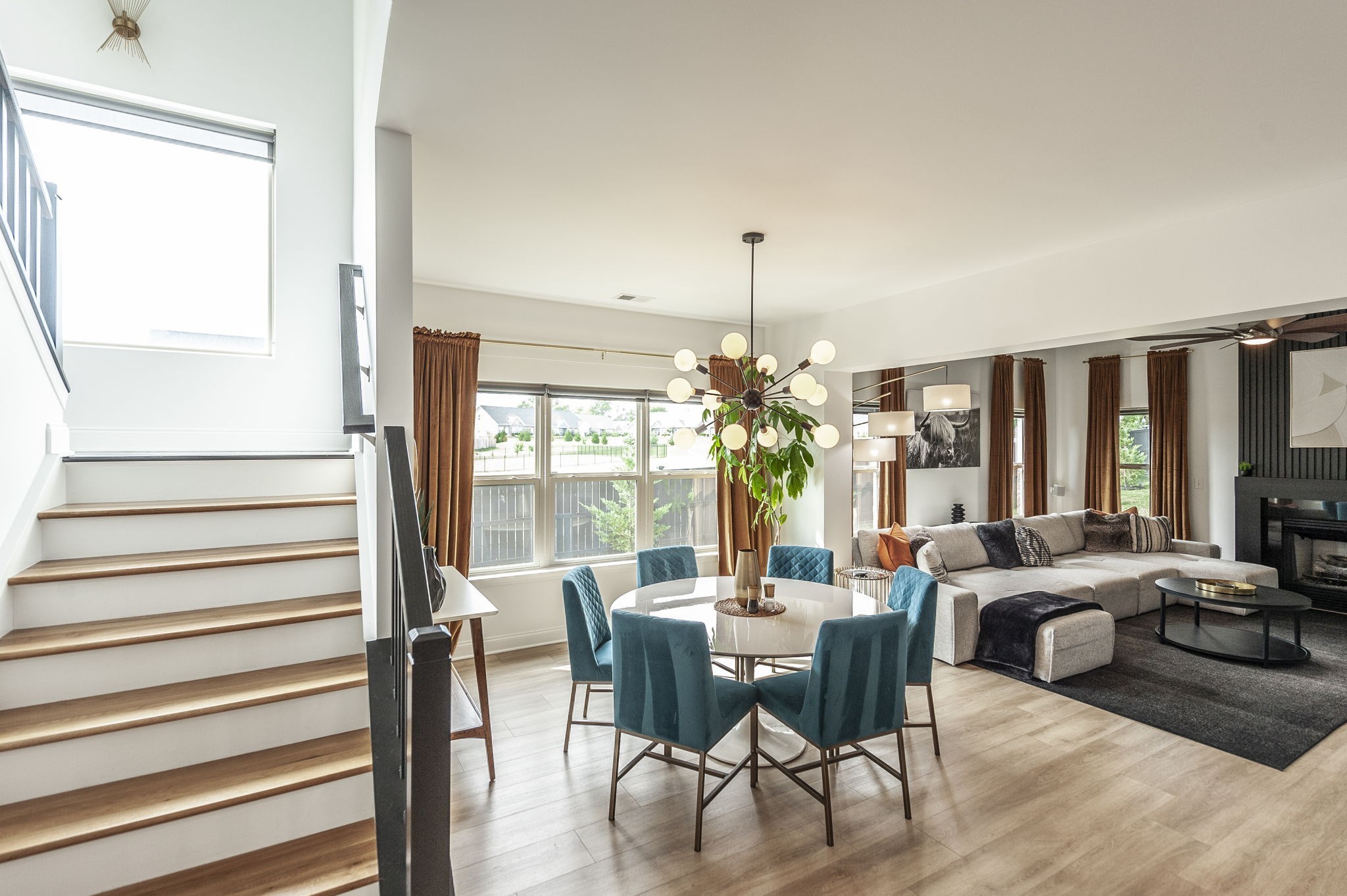 400 Quarry Road Gallatin, TN 37066 - Photo 27 of 81 a view of a dining room with furniture a chandelier and wooden floor