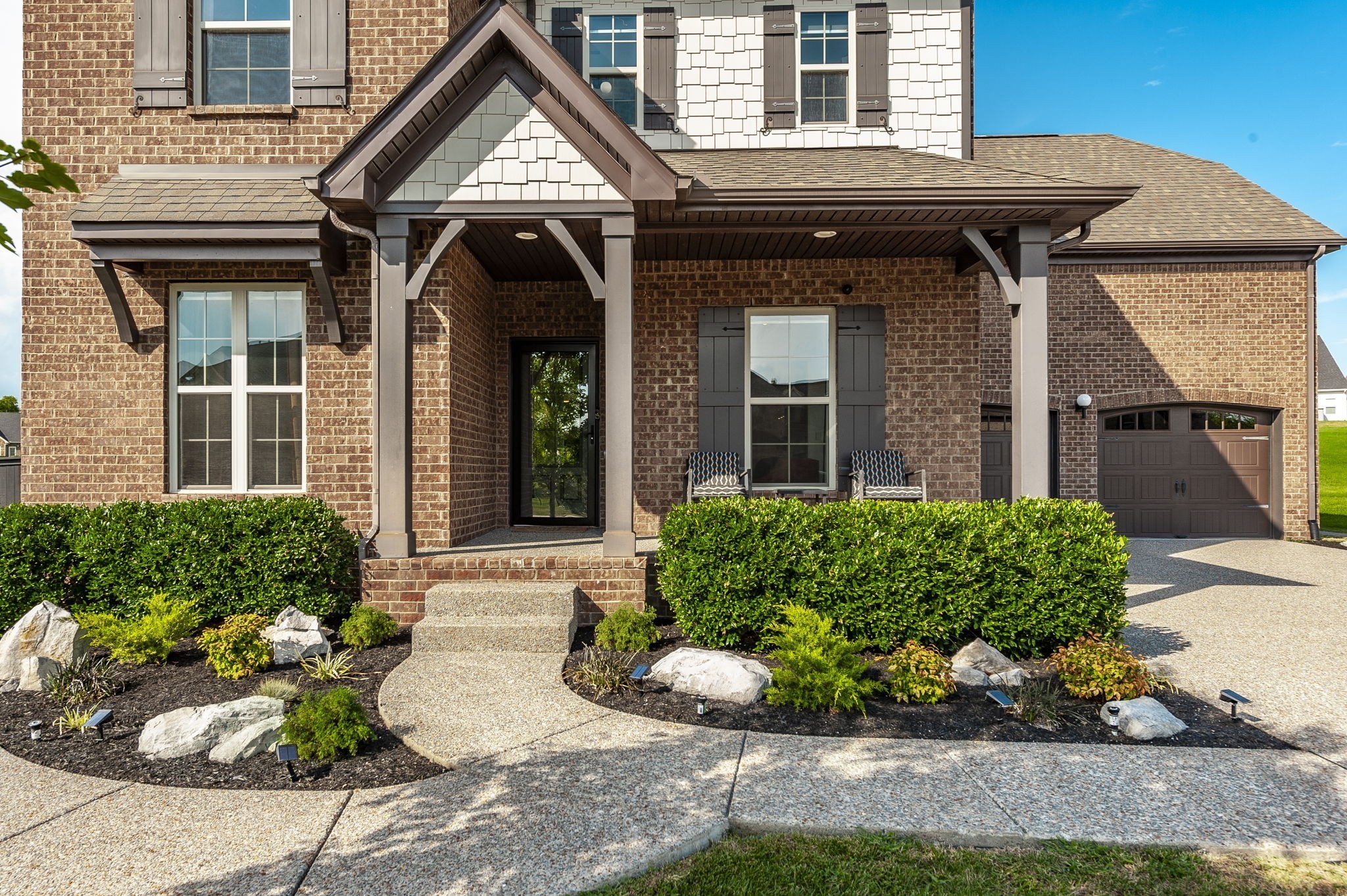 400 Quarry Road Gallatin, TN 37066 - Photo 8 of 81 a front view of a house with a yard and potted plants