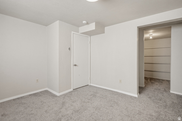 337 North Main Street Central Valley, UT 84754 - Photo 38 of 40 Unfurnished bedroom featuring light colored carpet and a spacious closet