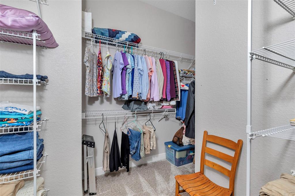 1989 Northwest 111th Loop Ocala, FL 34475 - Photo 23 of 55 a view of walk in closet with clothes and shoes