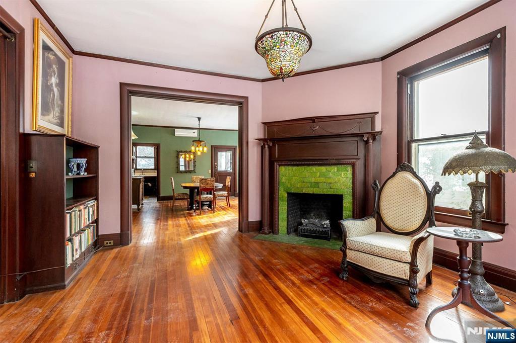20 Prospect Terrace Montclair, NJ 07042 - Photo 12 of 49 a living room with furniture a fireplace and a flat screen tv
