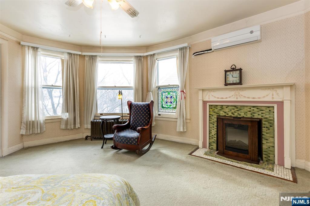 20 Prospect Terrace Montclair, NJ 07042 - Photo 30 of 49 a living room with furniture and a fireplace