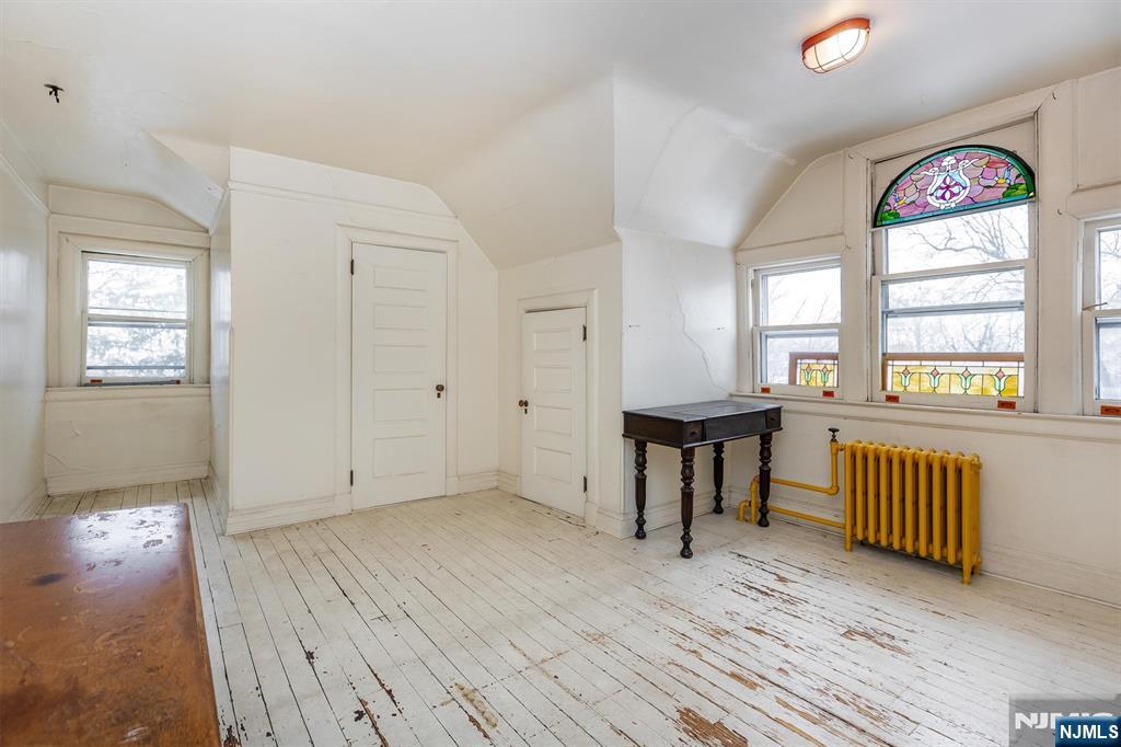 20 Prospect Terrace Montclair, NJ 07042 - Photo 45 of 49 a view of an empty room with window and wooden floor
