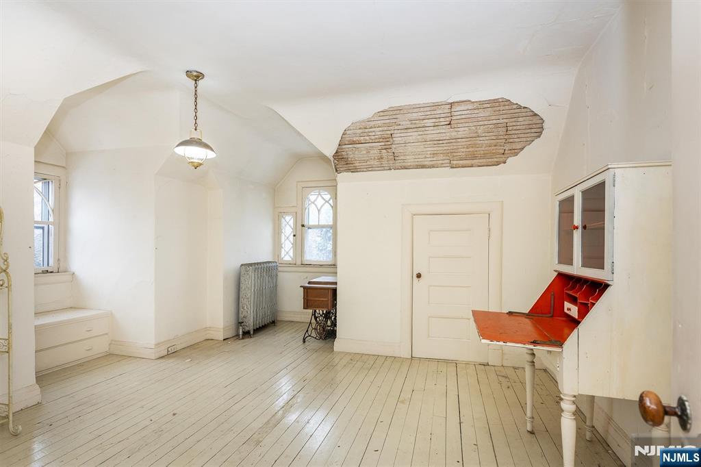 20 Prospect Terrace Montclair, NJ 07042 - Photo 46 of 49 a view of a room with wooden floor and windows