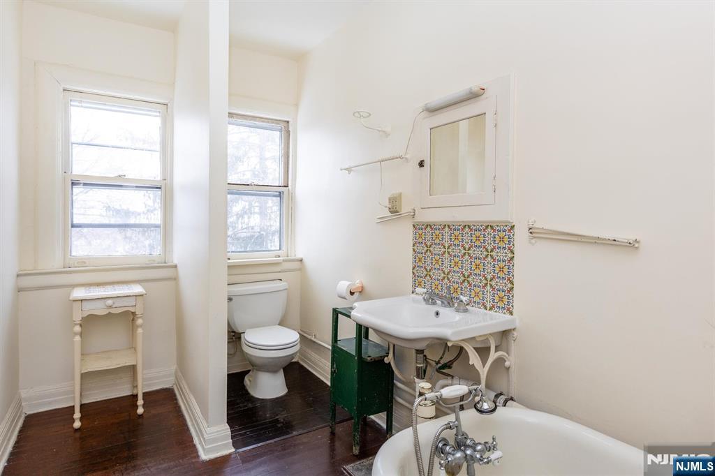 20 Prospect Terrace Montclair, NJ 07042 - Photo 49 of 49 a bathroom with a sink a toilet and a window