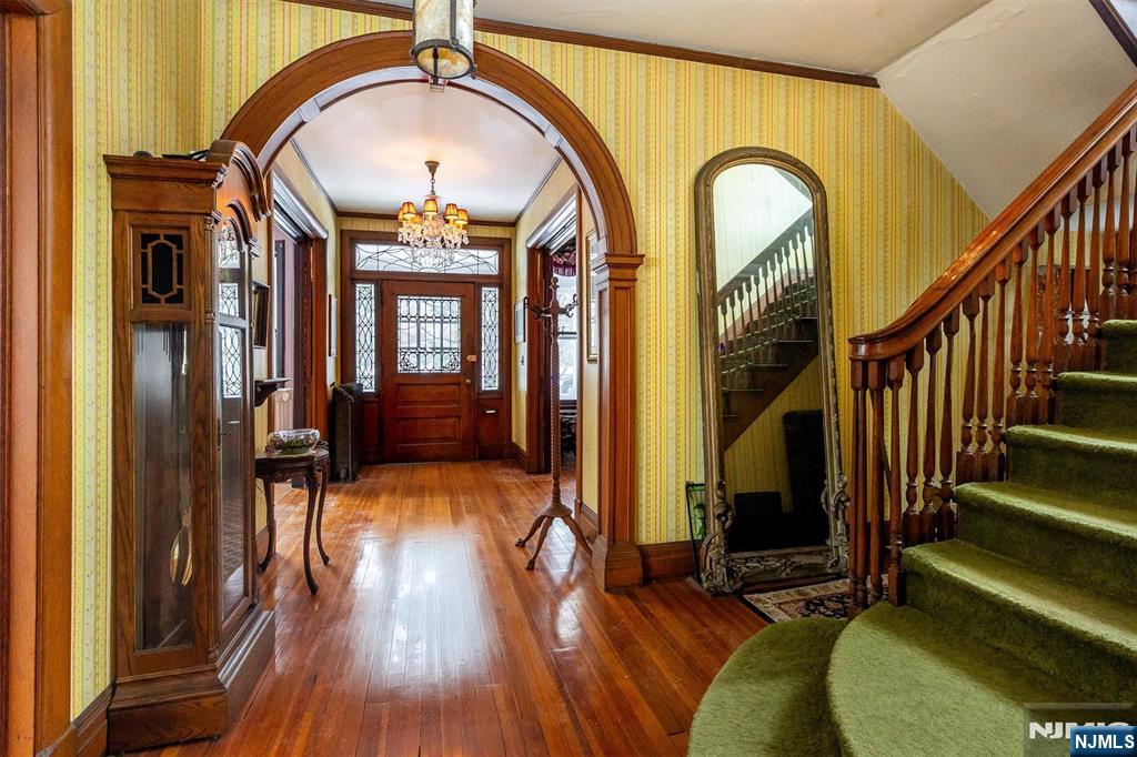 20 Prospect Terrace Montclair, NJ 07042 - Photo 6 of 49 a view of staircase with wooden floor and a fireplace