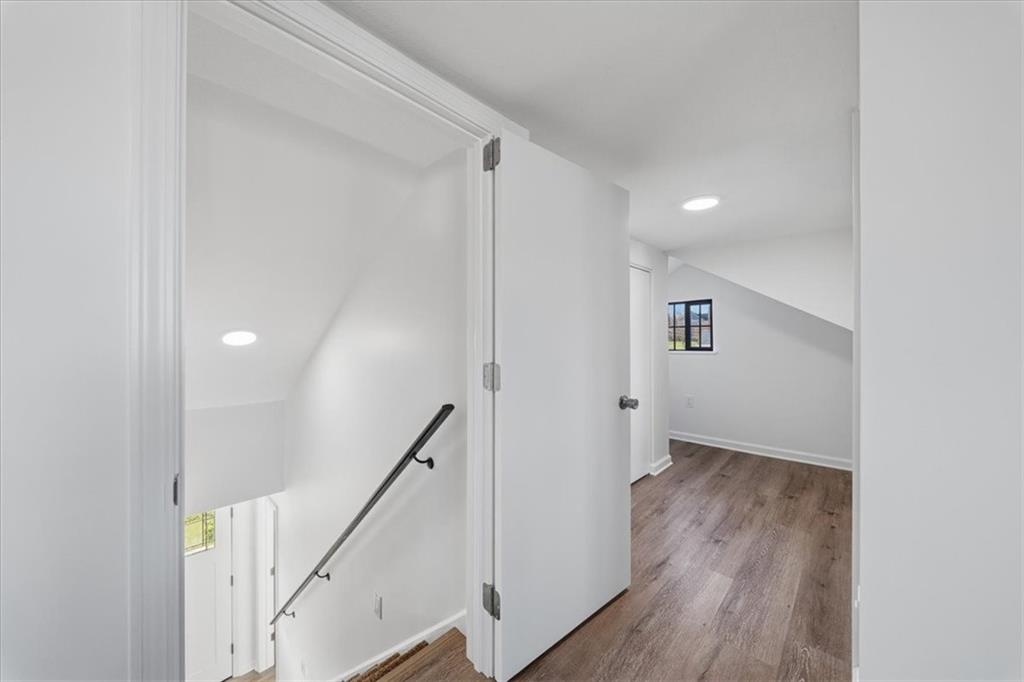 1216 Eckert Road Monaca, PA 15061 - Photo 23 of 30 a view of a hallway with wooden floor and staircase