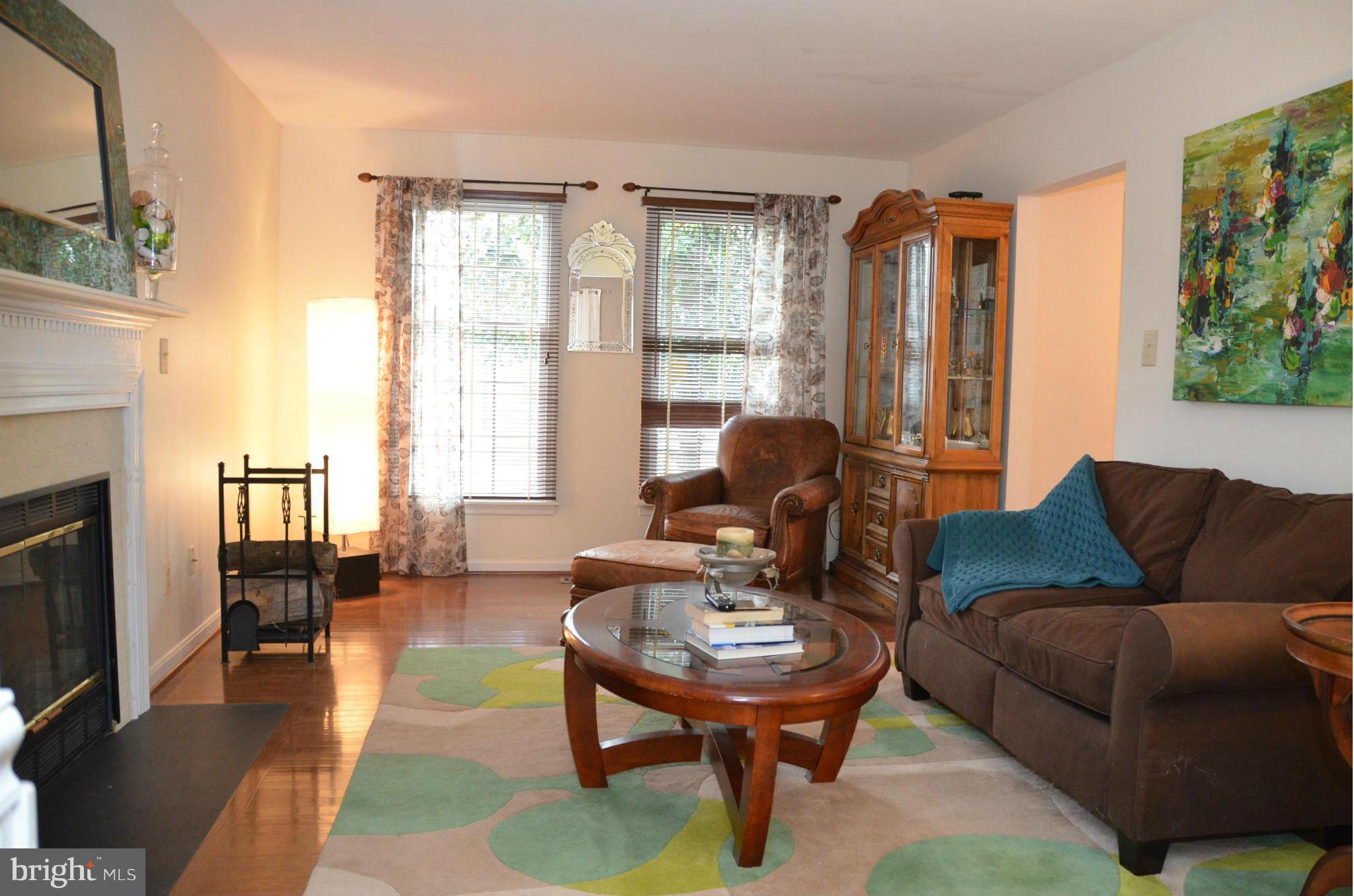 5605 Gunner Run Road Churchton, MD 20733 - Photo 9 of 30 a living room with furniture and a fireplace