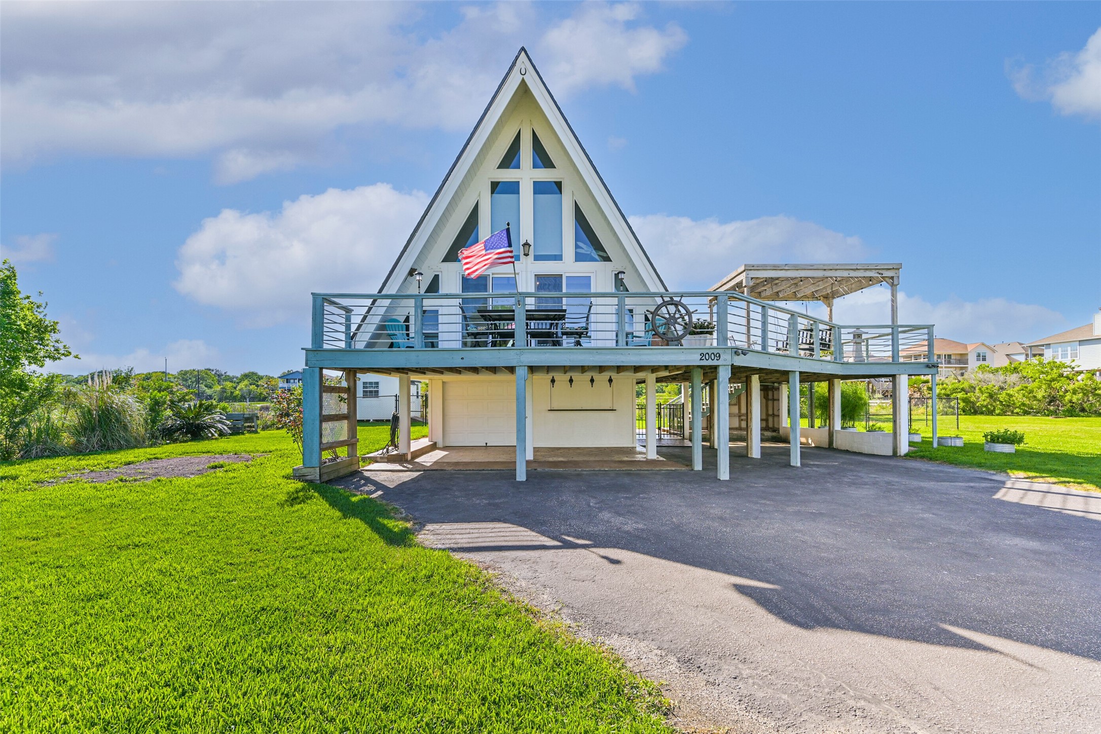 2009 Todville Road Seabrook, TX 77586 - Photo 40 of 46 a view of a big house with a big yard and large trees