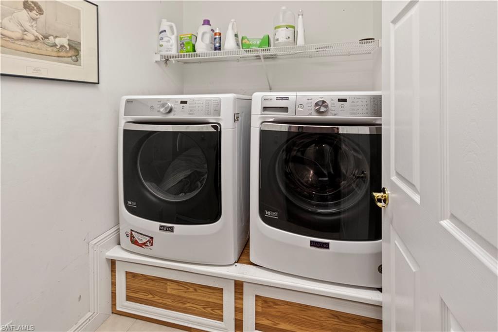 9801 Foxhall Way, Unit 5 Estero, FL 33928 - Photo 22 of 26 a utility room with dryer and washer
