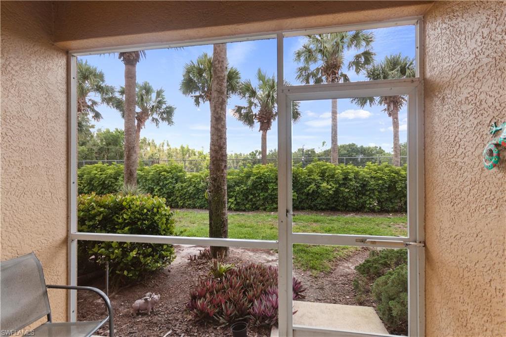 9801 Foxhall Way, Unit 5 Estero, FL 33928 - Photo 23 of 26 a view of a porch with a tree